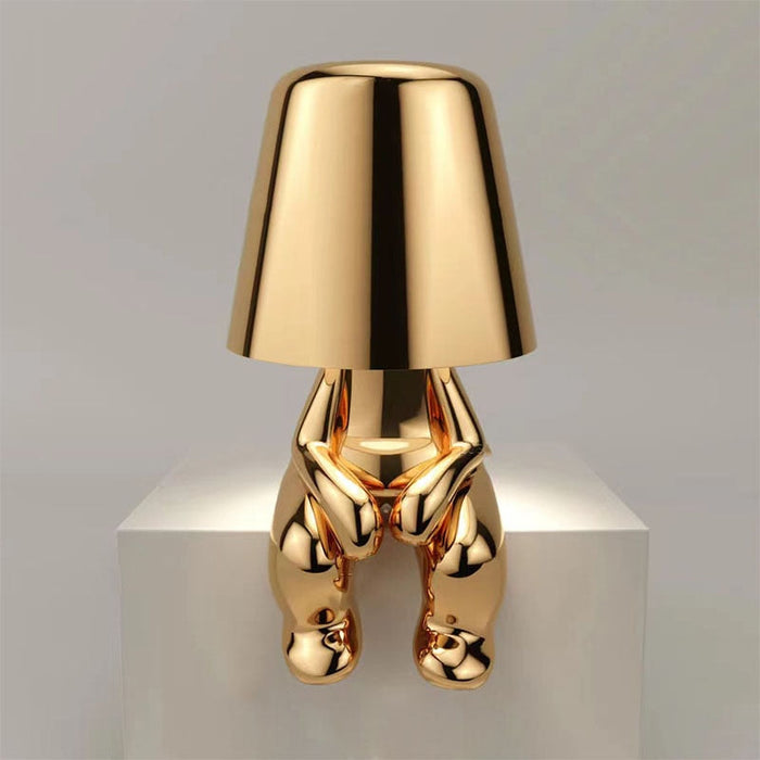 The Thinking Man's Little Golden Man Table Lamp: Lighting Up Creative Inspiration