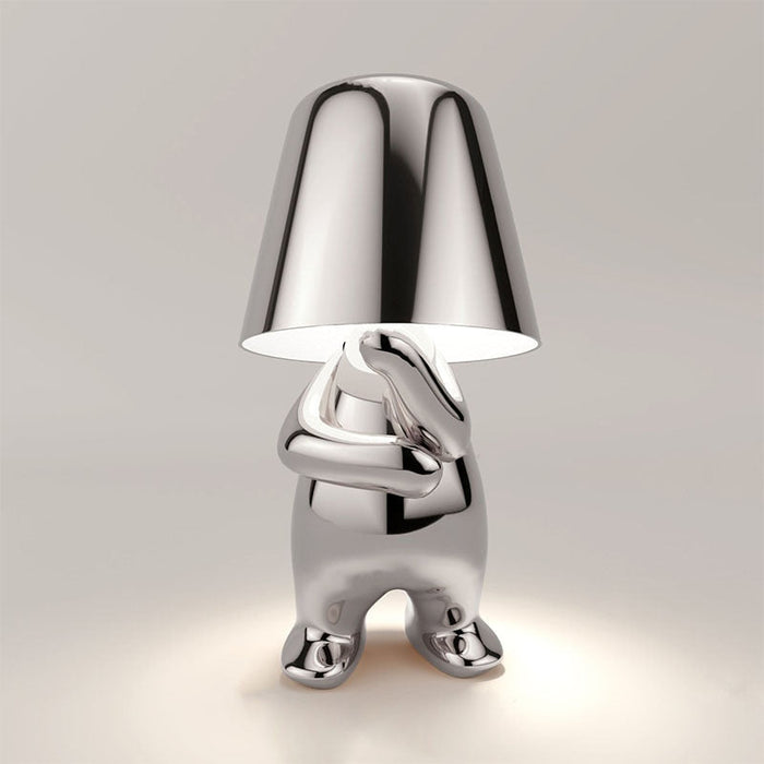 The Thinking Man's Little Golden Man Table Lamp: Lighting Up Creative Inspiration