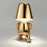 The Thinking Man's Little Golden Man Table Lamp: Lighting Up Creative Inspiration