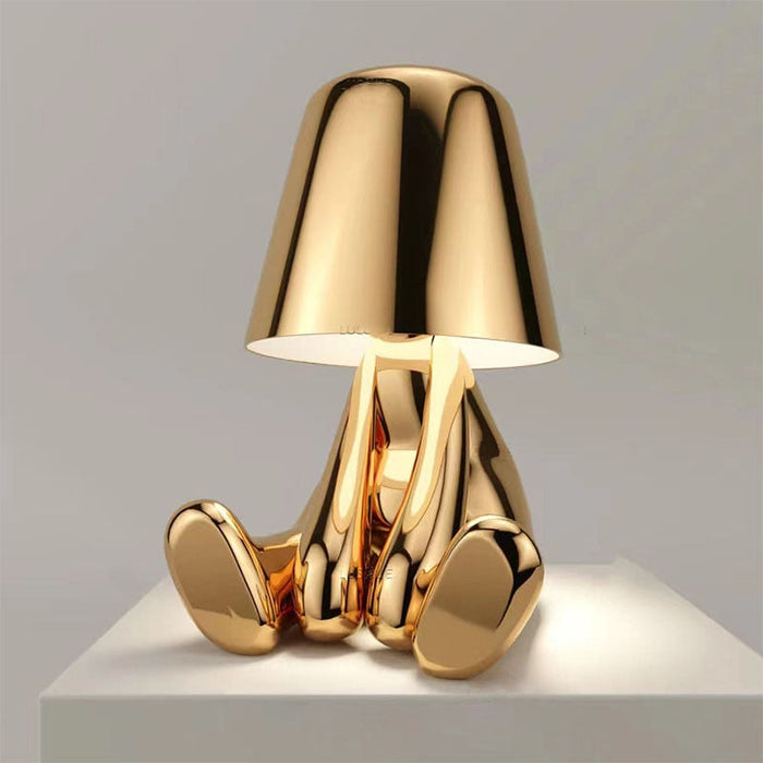 The Thinking Man's Little Golden Man Table Lamp: Lighting Up Creative Inspiration